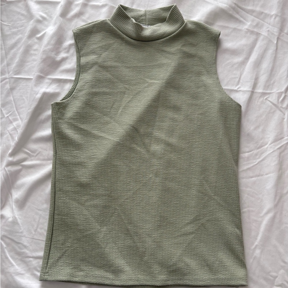 green sleeveless mock neck top